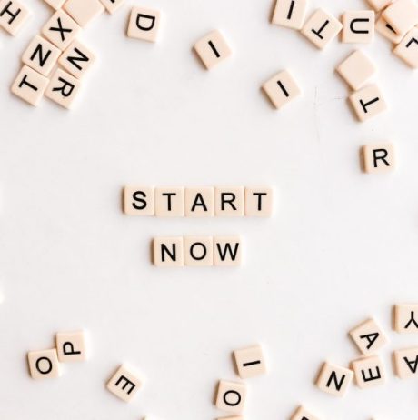 text 'start now' made from scrabble tiles